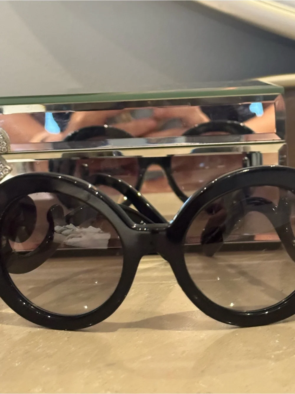 Prada Black Round Sunglasses with Swirl Arms